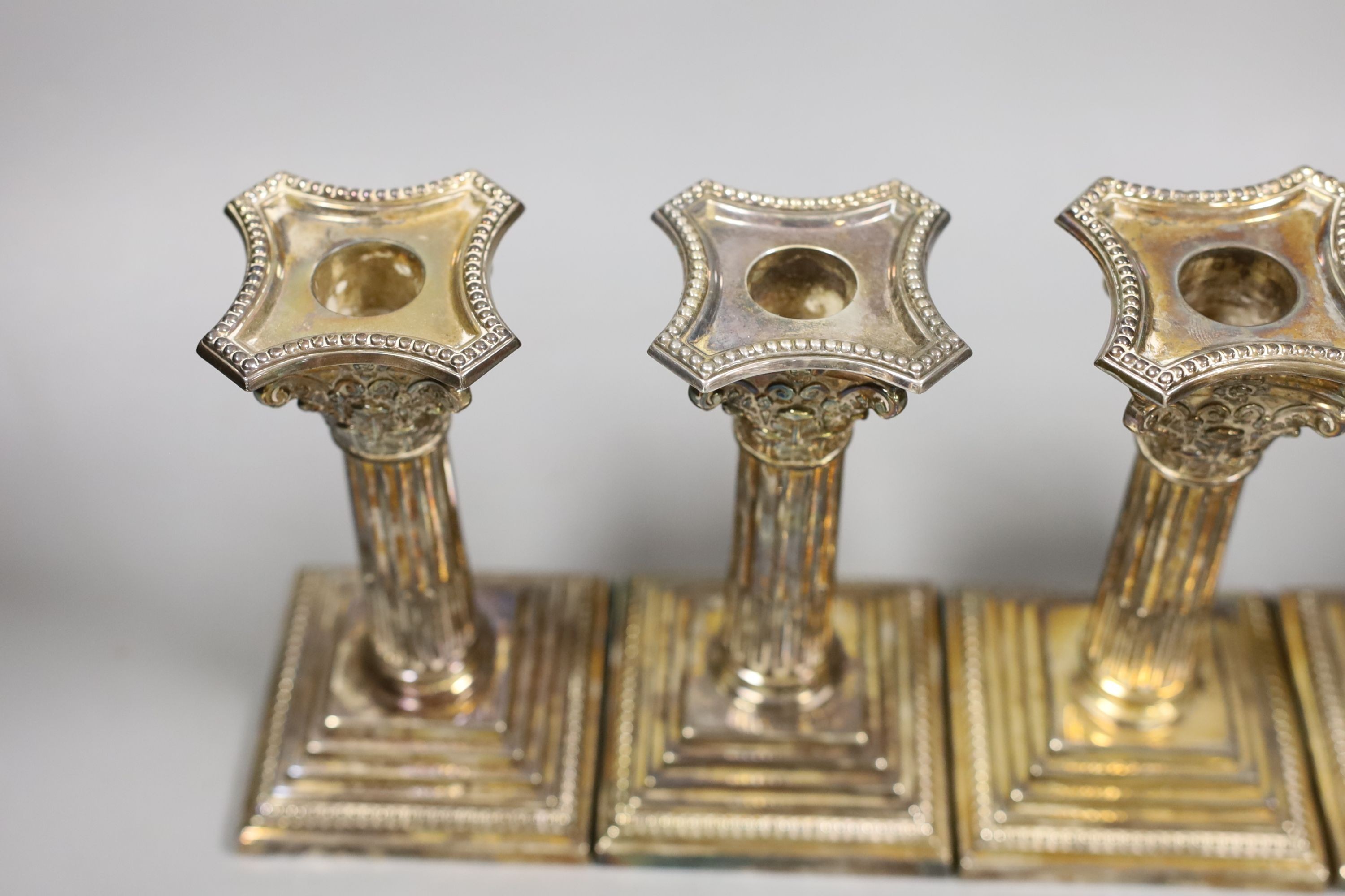 A set of four modern silver Corinthian column dwarf candlesticks, James Dixon & Sons, Sheffield, 1972, weighted, 14.5cm.